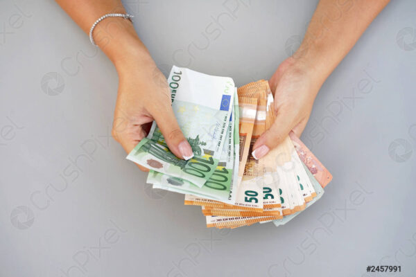 woman hands hold counting euro 2457991
